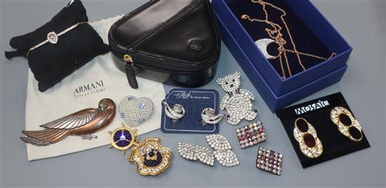 A group of assorted costume jewellery including Armani, Butler & Wilson and Swarovski.